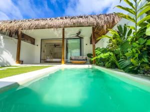 a swimming pool in front of a villa at Hoshi Villas in General Luna