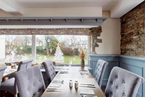 a dining room with a long table and chairs at The Briery in Workington