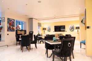 a dining room with black chairs and a table at Trip Inn Hotel Astoria in Göttingen