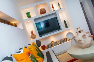 TV a/nebo společenská místnost v ubytování Riad Prive
