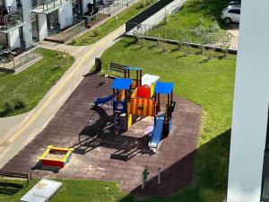 an aerial view of a playground in a park at New luxury modern Apartment in Šnipiškės in Vilnius