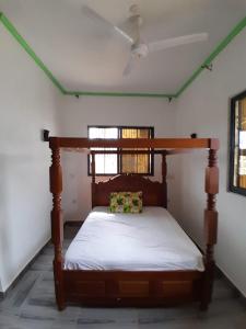 Ένα ή περισσότερα κρεβάτια σε δωμάτιο στο Chero-Palms