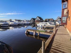 a group of boats docked in a marina at Daisy Lodge in Norwich