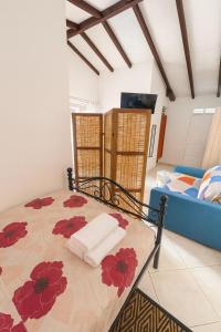 Postel nebo postele na pokoji v ubytování Studio Cosy avec espace piscine à la villa Boucard