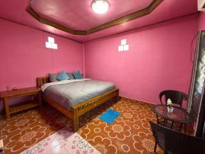 Giường trong phòng chung tại Danai Guesthouse