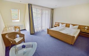 Ένα ή περισσότερα κρεβάτια σε δωμάτιο στο Hotel Walkenstein