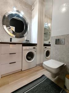 Ένα μπάνιο στο Apartament Osiedle Piano Park Suwałki