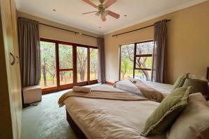 Ένα ή περισσότερα κρεβάτια σε δωμάτιο στο Elements Bush Villa 18 +36 φωτογραφίες