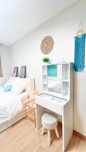 Postel nebo postele na pokoji v ubytování 루미스테이