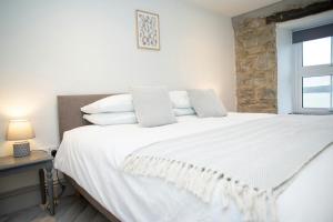 Postel nebo postele na pokoji v ubytování Bay View New Quay