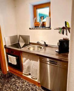 a kitchen with a sink and a counter top at Monteur und Ferienwohnung nahe Ulm Zentrum, Legoland Deutschland 
