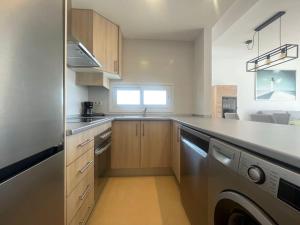 a kitchen with a sink and a dishwasher at Las Terrazas Golf Cédric in Torre-Pacheco +2 photos