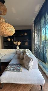 a bedroom with two beds and a large window at BOHO Oasis Radom - Dom z parkingiem in Radom