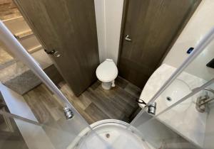 an overhead view of a bathroom with a toilet and a shower at Luxury Oceanfront Trailer Home Cerritos in San Carlos