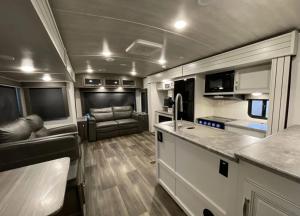 a kitchen and living room of an rv at Luxury Oceanfront Trailer Home Cerritos in San Carlos