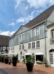 a large white building with a gray roof at Ferienwohnung Wethmüller in der Altstadt in Rinteln