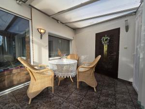 a table and chairs sitting on a patio at Ferienhaus Alla, Neeberg/Usedom in Neeberg