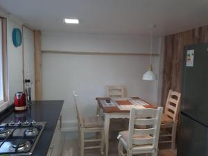 Kuchyň nebo kuchyňský kout v ubytování Departamento viña del mar cercano a mall y playa + 9 fotografií