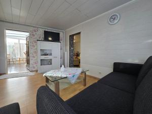 a living room with a couch and a table at Ferienhaus Alla, Neeberg/Usedom in Neeberg
