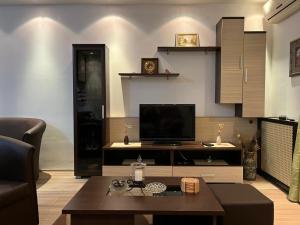a living room with a tv and a coffee table at EukaVita in Banja Koviljača