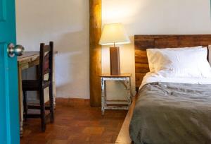 Ένα ή περισσότερα κρεβάτια σε δωμάτιο στο La Agustina, cabaña en la naturaleza de Barichara