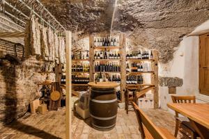 a wine cellar with a large barrel in a room at Holiday Home Pr'Lukčevih with 4 Bedrooms & Sauna in Kanal