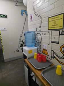 a kitchen counter with a mixer and a sink at The Hostel in Kyiv