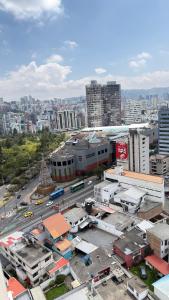an aerial view of a city with buildings at Modern Studio close by La Carolina Metro station in Quito