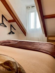 Ένα ή περισσότερα κρεβάτια σε δωμάτιο στο L'évidence +3 φωτογραφίες