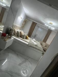 a white room with a shelf with pillows at GOLD apartment in Święta Katarzyna +21 photos