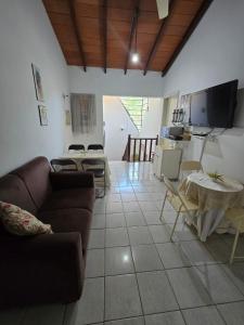 a living room with a couch and a table at Esquina Mburucuya in Asunción