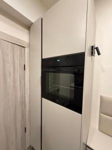 a kitchen with a built in oven in a room at Apartament for Guest in Jelgava