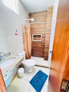 Koupelna v ubytování Suíte Pé na Areia Arraial do Cabo + 11 fotografií