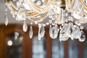 a bunch of crystals hanging from a chandelier at GuestReady - Urban rustic in Esposende in Esposende