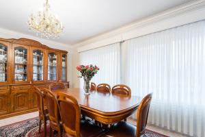 a dining room with a table and chairs and a chandelier at GuestReady - Urban rustic in Esposende in Esposende +33 photos