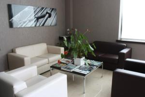 a living room with a couch and a table at Hotel Pontes do Eume in Puentes de García Rodríguez