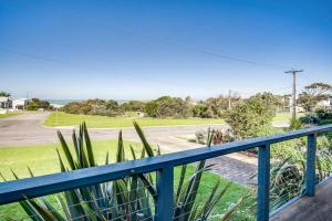 a view from the balcony of a house with the ocean at Island View in Hayborough