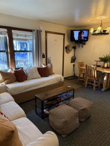 a living room with a couch and a table at Lakeside Condo Close to Slopes Excellent Location in Tahoe Vista