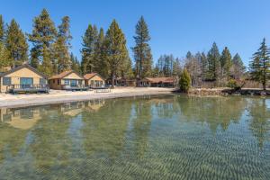 a large body of water with houses in the background at Lakeside Condo Close to Slopes Excellent Location in Tahoe Vista