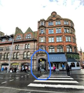 a blue circle on a street in front of a building at Modern Studio, 1st floor, King Street Views in Nottingham +13 photos
