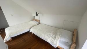 Postel nebo postele na pokoji v ubytování Maro Appartments