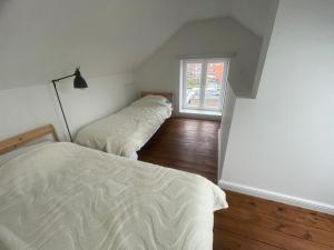 Postel nebo postele na pokoji v ubytování Maro Appartments