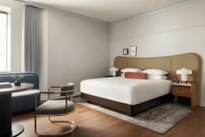 a bedroom with a bed and a desk and a chair at Kimpton Hotel Monaco Seattle by IHG in Seattle +75 photos