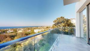 a balcony with a view of the ocean at Villa Cypress Villas in Kyrenia