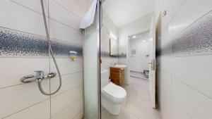 a white bathroom with a toilet and a shower at Villa Cypress Villas in Kyrenia +15 photos