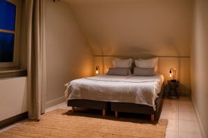 Postel nebo postele na pokoji v ubytování Hoeve Hazegras + 114 fotografií