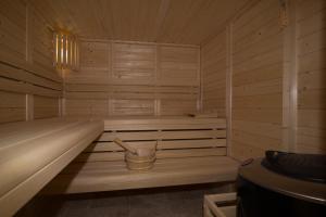 a sauna with a tub and a bucket in it at Le Clos Réaud in Blaye +144 photos