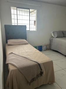 Ένα ή περισσότερα κρεβάτια σε δωμάτιο στο Casa Urbis