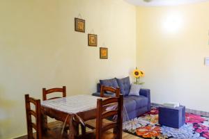 a living room with a couch and a table at Ulises House in Luque +29 photos