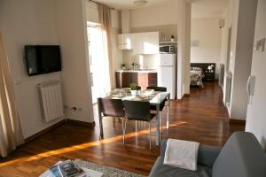 a kitchen and dining room with a table and chairs at Residence Le Terrazze in Trieste